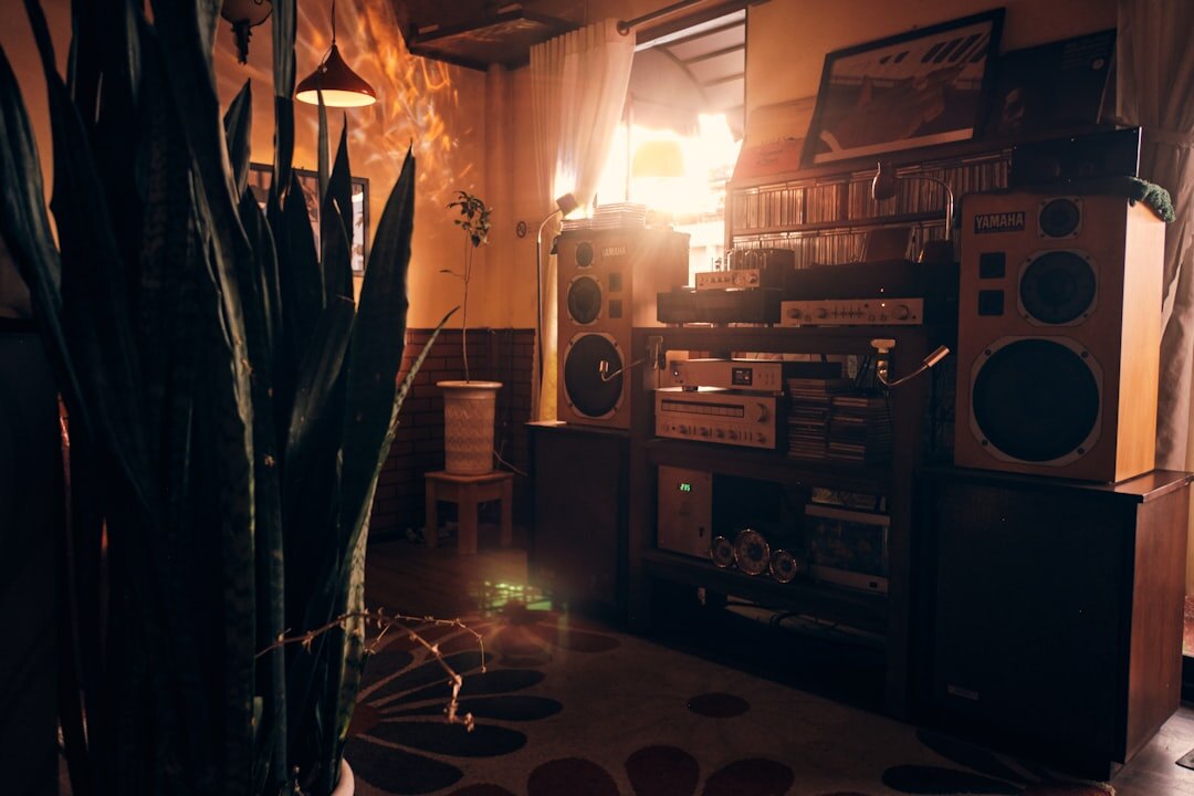 Vintage home recording studio with analog mixing console and warm lighting