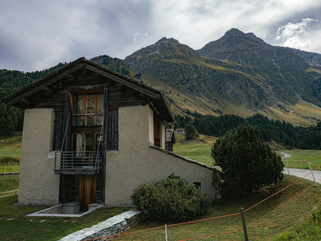Traditional Swiss alpine chalet exterior with wooden facade and mountain view